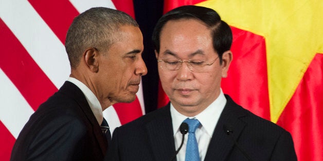 US President Barack Obama and Vietnamese President Tran Dai Quang (R) take part in a joint press conference in Hanoi on May 23, 2016.US President Barack Obama praised 'strengthening ties' between the United States and Vietnam at the start of a landmark visit on May 23, as the former wartime foes deepen trade links and share concerns over Chinese actions in disputed seas. / AFP / JIM WATSON (Photo credit should read JIM WATSON/AFP/Getty Images)