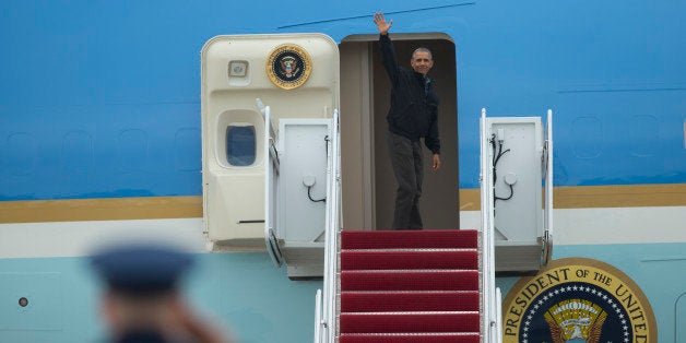 President Barack Obama waves as he boards Air Force One, Saturday, May 21, 2016, at Andrews Air Force Base, Md. on his way to