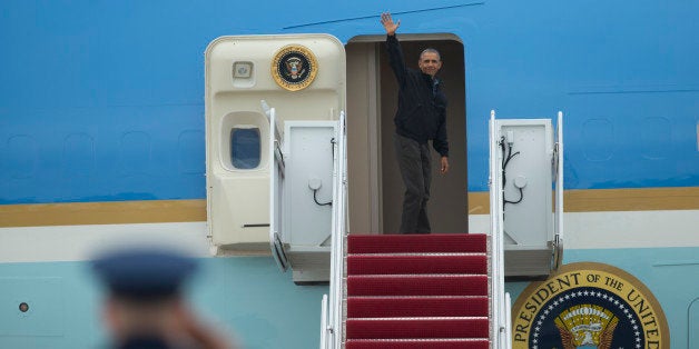 President Barack Obama waves as he boards Air Force One, Saturday, May 21, 2016, at Andrews Air Force Base, Md. on his way to Vietnam. He'll spend three days in Vietnam, with stops in Hanoi and Ho Chi Minh City, formerly Saigon, before heading to Japan for a summit of the Group of Seven industrialized nations and a historic visit to Hiroshima. (AP Photo/Evan Vucci)