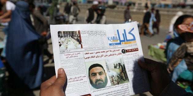 An Afghan man reads a local newspaper with photos the former leader of the Afghan Taliban, Mullah Akhtar Mansoor, who was killed in a U.S. drone strike last week, in Kabul, Afghanistan, Wednesday, May 25, 2016. The Afghan Taliban has confirmed that its former leader Mullah Akhtar Mansour was killed in a U.S. drone strike last week and appointed a successor. In a statement sent to media Wednesday, May 25, 2016, the insurgent group said its new leader is Mullah Haibatullah Akhundzada, one of two Mansour's deputies. (AP Photo/Rahmat Gul)