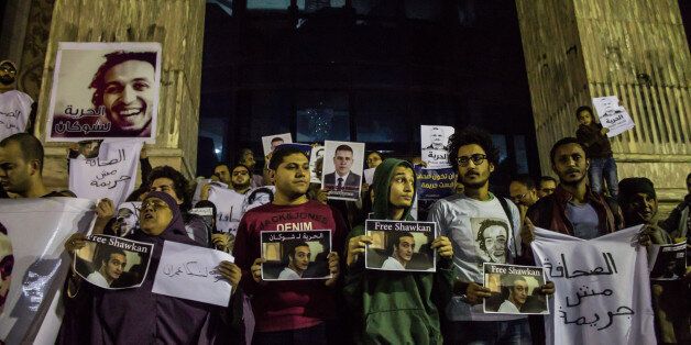 CAIRO, EGYPT - 2015/12/09: Journalists and activists bring placards and shout slogans as they gather in front of the Press Syndicate in Cairo, demanding the release of jailed journalists. (Photo by Fayed El-Geziry/Pacific Press/LightRocket via Getty Images)