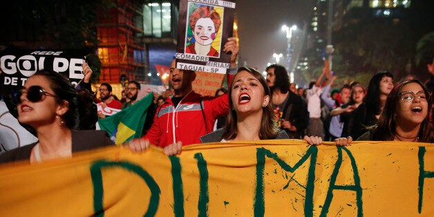 People demonstrate against Brazil's acting President Michel Temer and in support of suspended President Dilma Rousseff in Sao Paulo, Brazil, Friday, May 20, 2016. Temer took office last week after Rousseff was suspended for up to 180 days while the Senate holds an impeachment trial. (AP Photo/Andre Penner)