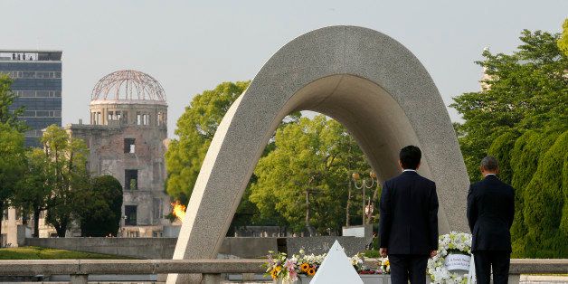 Japanese Prime Minister Shinzo Abe (2nd R) looks on as US President Barack Obama (R) lays a wreath during a visit to the Hiroshima Peace Memorial Park in Hiroshima on May 27, 2016.Obama on May 27 paid moving tribute to victims of the world's first nuclear attack. / AFP / POOL / KIMIMASA MAYAMA (Photo credit should read KIMIMASA MAYAMA/AFP/Getty Images)