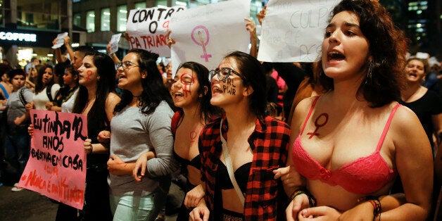 Women march during a protest against the gang rape of a 16-year-old girl in Sao Paulo, Brazil, Wednesday, June 1, 2016. In response to the assault, Brazil's interim President Michel Temer said that Brazil will set up a specialized group to fight violence against women. (AP Photo/Andre Penner)