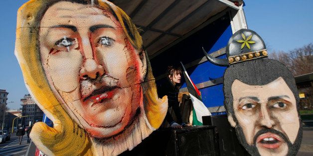 Drawings depicting French far right leader Marine Le Pen, left, and Italian Northern League leader Matteo Salvini are attached to a truck during a demonstration against the 2-day convention of European nationalists, in Milan, Italy, Friday, Jan. 29, 2016. The rally is being billed by organizers as the first congress of the Europe of Nations and Freedom group within the European Parliament, which was formed last year. (AP Photo/Luca Bruno)