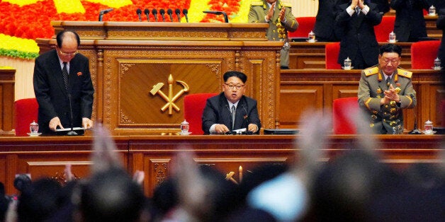 North Korean leader Kim Jong Un (C) receives applause from participants at the first congress of the country's ruling Workers