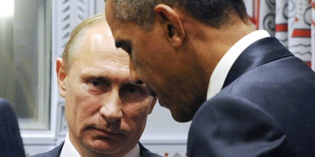 U.S. President Barack Obama, right, gestures while speaking to Russian President Vladimir Putin before a bilateral meeting at United Nations headquarters in New York, Monday, Sept. 28, 2015. (Mikhail Klimentyev, RIA-Novosti, Kremlin Pool Photo via AP)