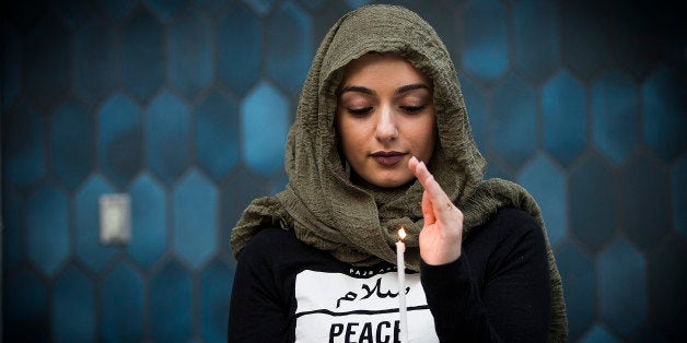 LOS ANGELES, CALIF. -- MONDAY, JUNE 13, 2016: Marwa Balkar holds a candle at the Islamic Center of Southern California and ICUJP Interfaith Vigil Against Violence and Hatred Monday, June 13 in remembrance of the 50 people killed in Orlando, Florida on June 12 at the mosque in Los Angeles, Calif., on June 13, 2016. The vigil was attended by speakers and public from a variety of different faiths. (Photo by Allen J. Schaben/Los Angeles Times via Getty Images)