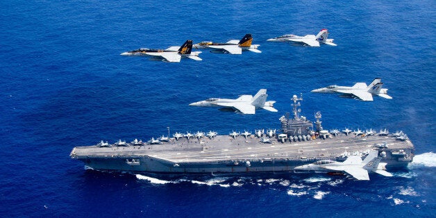 PHILIPPINE SEA - JUNE 18: In this handout provided by the U.S. Navy, a combined formation of aircraft from Carrier Air Wing