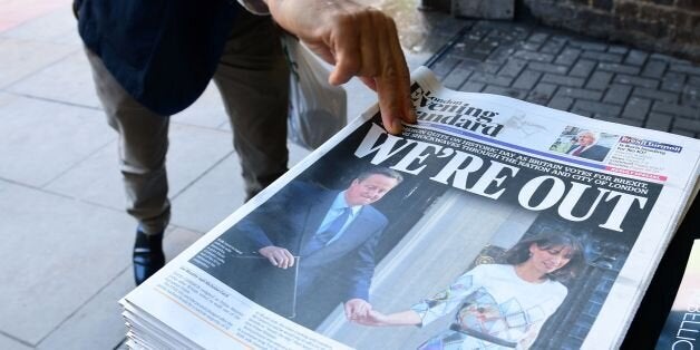 A man takes a copy of the London Evening Standard with the front page reporting the resignation of British Prime Minister David Cameron and the vote to leave the EU in a referendum, showing a pictured of Cameron holding hands with his wife Samantha as they come out from 10 Downing Street, in London on June 24, 2016. Britain voted to break away from the European Union on June 24, toppling Prime Minister David Cameron and dealing a thunderous blow to the 60-year-old bloc that sent world markets plunging. / AFP / LEON NEAL (Photo credit should read LEON NEAL/AFP/Getty Images)