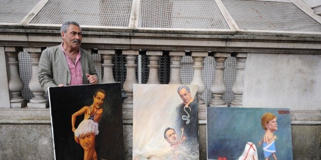 LONDON, UNITED KINGDOM - JUNE 24: A man stands with paintings after the UK has voted by 52% to 48% to leave the European Unio