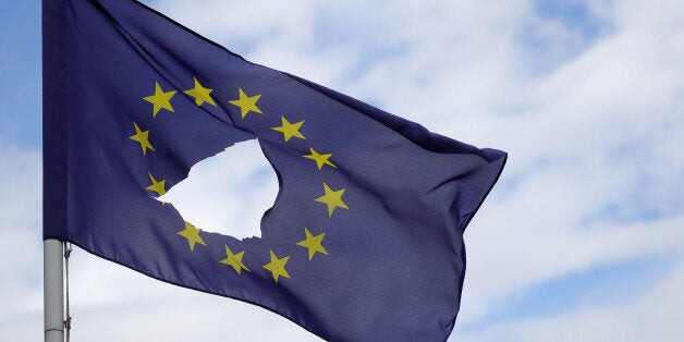 KNUTSFORD, UNITED KINGDOM - JUNE 24: A European Union flag, with a hole cut in the middle, flies at half-mast outside a home in Knutsford Cheshire after today's historic referendum on June 24, 2016 in Knutsford, United Kingdom. The results from the historic EU referendum has now been declared and the United Kingdom has voted to LEAVE the European Union. (Photo by Christopher Furlong/Getty Images)