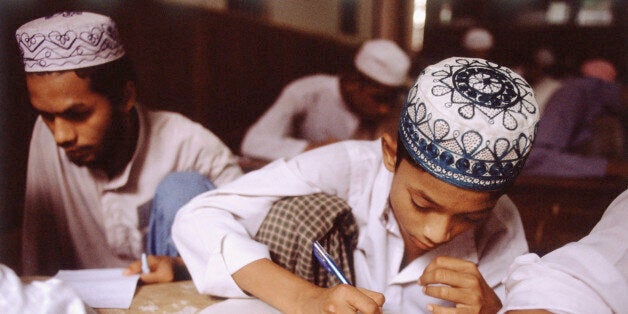 Myanmar (Burma), Yangon (Rangoon), Muslim students studying in school.