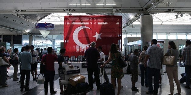 ISTANBUL, TURKEY - JULY 1 : Passengers are seen at the Ataturk International Airport after the air traffic and working proce