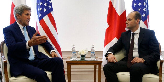 U.S. Secretary of State John Kerry, left, meets with Georgian Foreign Minister Mikheil Janelidze in Tbilisi, Georgia, Wednesday, July 6, 2016. The United States and Georgia agreed Wednesday to boost their military cooperation in a signal of America's commitment to Georgia's defense and a not-so-subtle message to Russia ahead of this week's NATO summit. (David Mdzinarishvili/ Pool Photo via AP)