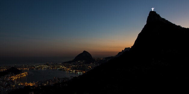 RIO DE JANEIRO, BRAZIL - JULY 06: View of the Christ the Redeemer and the Rodrigo de Freitas Lagoon during the sunset on July 6, 2016 in Rio de Janeiro, Brazil. The city of Rio de Janeiro already breathes the atmosphere of the Olympic Games, within 30 days to beginning. Rio 2016 will be the first Olympic Games in South America. The event will take place between 5 to 21 August. (Photo by Buda Mendes/Getty Images)