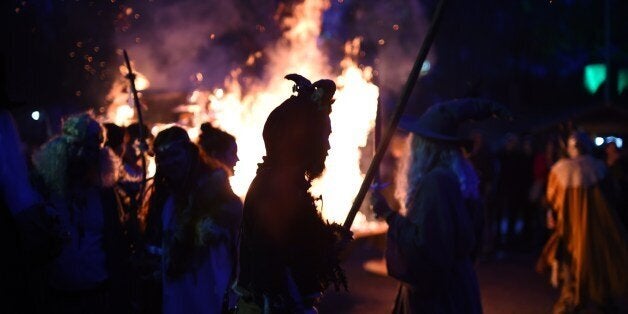 Revellers dance around a fire as they take part in Walpurgis Night (Walpurgisnacht) celebrations at the film park in Babelsbe
