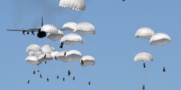 Polish troops land with parachutes at the military compound near Torun, central Poland, on June 7, 2016, as part of the NATO Anaconda-16 military exercise. Anaconda is the largest-ever military exercise involving NATO partners, amid the West's worst standoff with Russia since the end of the Cold War. / AFP / JANEK SKARZYNSKI (Photo credit should read JANEK SKARZYNSKI/AFP/Getty Images)