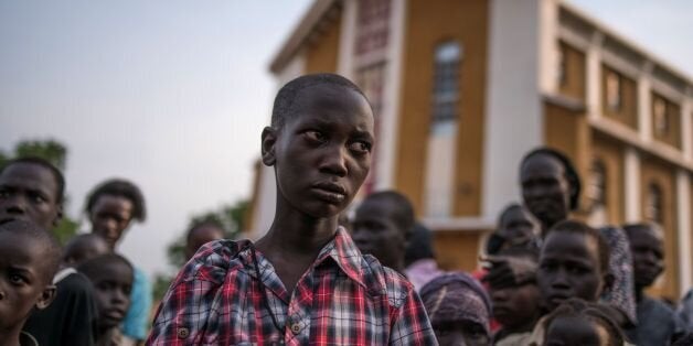 TOPSHOT - Steven, a young orphaned boy from the recent fighting in Juba who has lost his family from the fighting in Munuki stands on July 12, 2016 in Juba .Many people have fled their homes after heavy fighting started in Juba, and spread to some residential areas in the capital of South Sudan on the eve of independence. Fighting resumed the day after independence and the numbers of casualties are reported to be in the hundreds. A cease fire was declared on the 11th by the President of South Sudan, Salva Kiir Mayardit, and the First Vice President Dr. Riek Machar also reciprocated and declared a ceasefire. / AFP / Charles Atiki Lomodong (Photo credit should read CHARLES ATIKI LOMODONG/AFP/Getty Images)