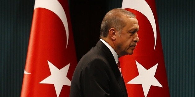 Turkish President Tayyip Erdogan leaves after a news conference following the National Security Council and cabinet meetings at the Presidential Palace in Ankara, Turkey, July 20, 2016. REUTERS/Umit Bektas