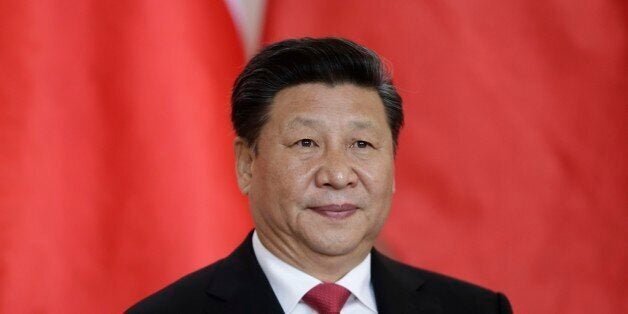 Chinese president Xi Jinping waits before signing a bilateral treaty of strategic partnership with the Czech Republic at the