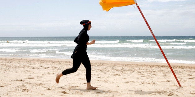 Twenty-year-old trainee volunteer surf life saver Mecca Laalaa runs along North Cronulla Beach in Sydney during her Bronze me