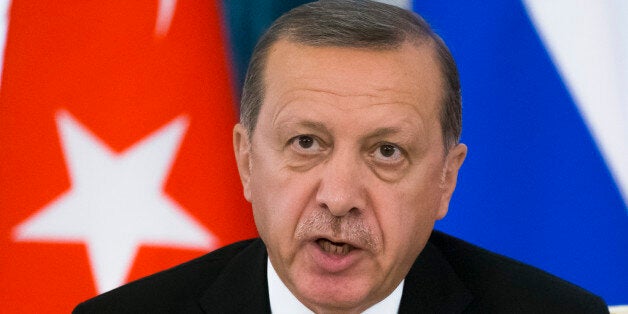 Turkish President Recep Tayyip Erdogan speaks at a news conference after his talks with Russian President Vladimir Putin in t