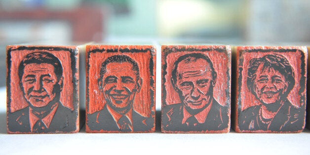 HANGZHOU, CHINA - JUNE 19: (CHINA OUT) Portrait signets of G20 leaders Chinese president Xi Jinping (L1), American president
