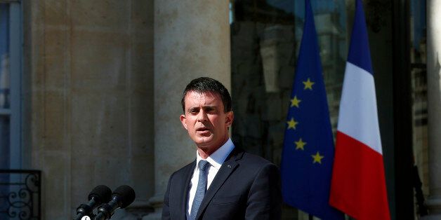 French Prime Minister Manuel Valls speaks to media after a security meeting at the Elysee Palace, in Paris, Friday, July 15, 2016. Prime Minister Valls said the government is declaring three days of national mourning after the attack in Nice. Speaking after an emergency meeting, Valls said the national mourning would begin Saturday. (AP Photo/Thibault Camus)