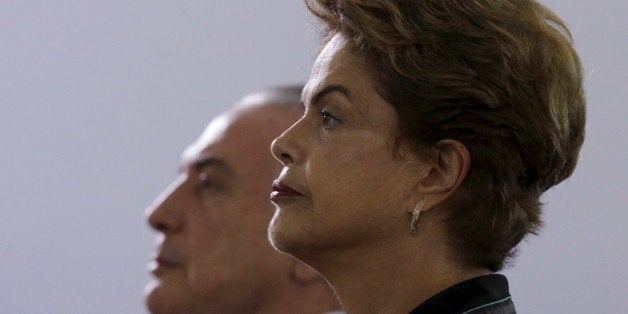 Brazil's President Dilma Rousseff (R) and Vice President Michel Temer listens to Brazil's national anthem before an annual lunch with general officers in Brasilia, Brazil, December 16, 2015. REUTERS/Ueslei Marcelino