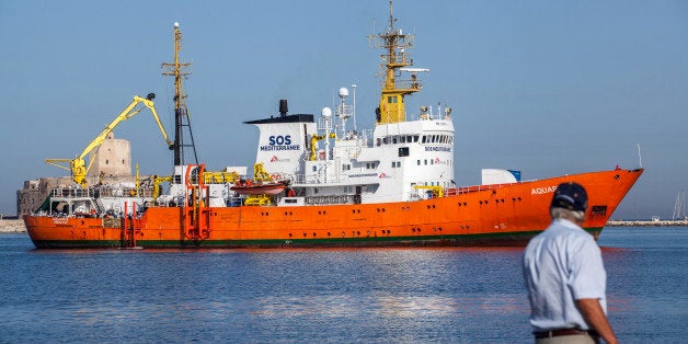 TRAPANI, ITALY - 2016/07/22: Migrants and refugees arrive at the Trapani port, with the Aquarius vessel after being rescued at sea. The bodies of 22 migrants recovered in the Mediterranean Sea, after the sinking of a rubber dinghy, arrived in Sicily on July 22, at the end of a week during which nearly 40 people died at sea. (Photo by Antonio Melita/Pacific Press/LightRocket via Getty Images)