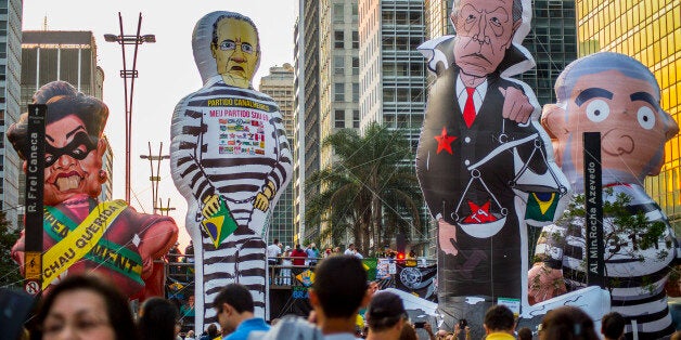 BRAZIL, Sao Paulo : Activists protest against suspended president Dilma Rousseff in Sao Paulo, Brazil on July 31, 2016.Protesters took to the streets of Brazil on Sunday to demand the final leaving of suspended President Dilma Rousseff or to defend her permanence, just five days before the start of the Rio 2016 Olympic Games. (Photo by Cris Faga/NurPhoto via Getty Images)