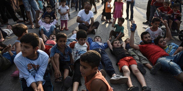 Migrants and refugees hold a protest against the living conditions at the Oreokastro camp, near the northern town of Thessalo