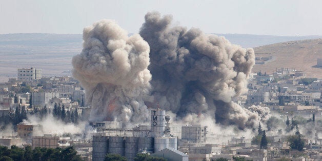 Smoke rises after an U.S.-led air strike in the Syrian town of Kobani Ocotber 8, 2014. U.S.-led air strikes on Wednesday push