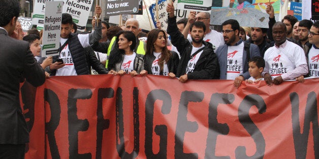 LONDON, UK - September 17: âA group of refugees seen at the front line of the Refugees Welcome demonstration, as thousands of people march through London to show solidarity with Refugees on 1â7â September 2016. The march from Hyde Park to Parlianet Square follows reports of the many people who have lost their lives including a young boy Aylan Kurdi trying to flee from their war torn countries to safety in Europe.â Last year the government agreed to resettle 20,000 Syrian refugees. (Photo by David Mbiyu/Corbis via Getty Images)