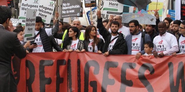 LONDON, UK - September 17: âA group of refugees seen at the front line of the Refugees Welcome demonstration, as thousands of people march through London to show solidarity with Refugees on 1â7â September 2016. The march from Hyde Park to Parlianet Square follows reports of the many people who have lost their lives including a young boy Aylan Kurdi trying to flee from their war torn countries to safety in Europe.â Last year the government agreed to resettle 20,000 Syrian refugees. (Photo by David Mbiyu/Corbis via Getty Images)