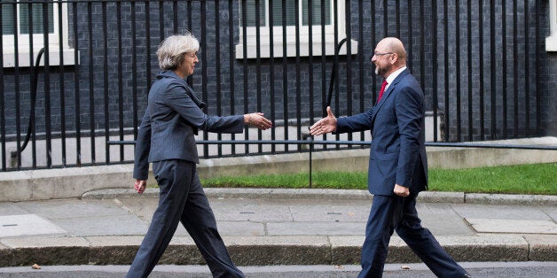 TOPSHOT - British Prime Minister Theresa May (L) greets President of the European Parliament Martin Schulz (R) outside 10 Dow