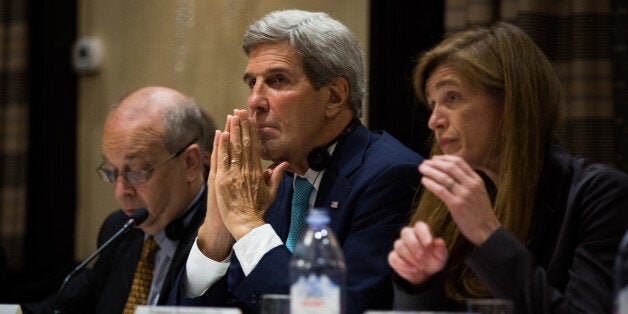 U.S. Secretary of State John Kerry listens during a trilateral meeting with the Republic of Korea and Japan Sunday, Sept. 18,