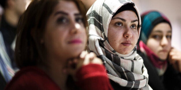 BERLIN, GERMANY - FEBRUARY 26: Refugees from different countries attend an information event at a new jobs counseling center for migrants and refugees at former Tempelhof Airport on February 26, 2016 in Berlin, Germany. Berlin city authorities are hoping to accelerate the integration of refugees and migrants into the local workforce. Germany took in 1.1 million migrants and refugees in 2015 and though the rate of influx has slowed so far in 2016 the country still expects large numbers to arrive this year. (Photo by Carsten Koall/Getty Images)