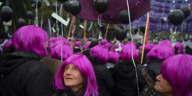 TOPSHOT - Women take part in the 'Ni una menos' (Not One Less) march against femicides in Buenos Aires, on June 3, 2016. / AFP / EITAN ABRAMOVICH (Photo credit should read EITAN ABRAMOVICH/AFP/Getty Images)