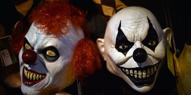 Clown costumes are displayed for sale at a store in the historical centre of Mexico City on October 17, 2016.Days before Halloween celebration, Latin American clowns hold their 21st annual conference in Mexico City from October 17 through 20 to discuss the lurking clown phenomenon as a wave of hysteria about sightings of 'creepy' or 'killer' clowns sweeps the United States and European nations. / AFP / Yuri CORTEZ (Photo credit should read YURI CORTEZ/AFP/Getty Images)