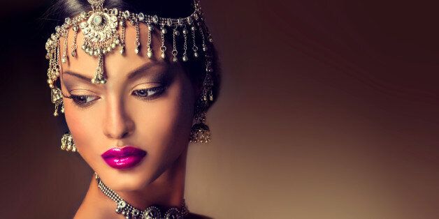 Beautiful Indian women portrait with jewelry . elegant Indian girl looking to the side ,bollywood style.