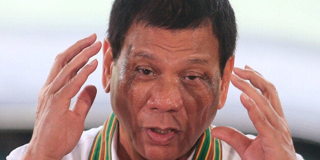 Philippines President Rodrigo Duterte gestures as he delivers a speech to the members of the Philippine Army during a visit a