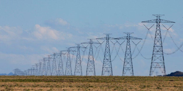 MILFORD, UT - MAY 10: Large power lines transport power from a wind turbine farm on May 10, 2016 outside Milford, Utah. The wind farm was built by First Wind and has a total of 165 wind turbines producing 306MW of power for Los Angeles, California. (Byline: George Frey, Byline Title: Contributor, Credit: Getty Images)