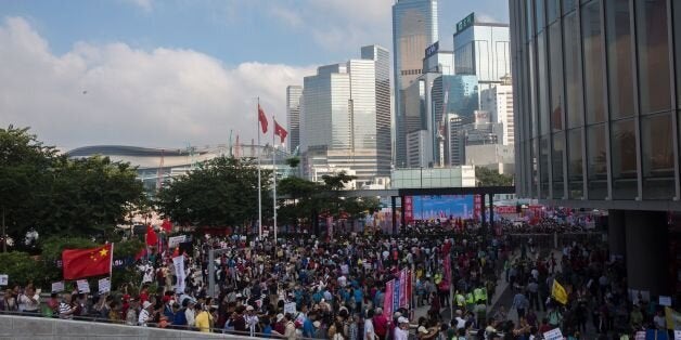 Pro-Beijing demonstrators gather outside the Hong Kong Legislative Council on November 13, 2016, during a rally in support of