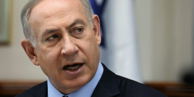 Israeli Prime Minister Benjamin Netanyahu chairs the weekly cabinet meeting in Jerusalem on January 1, 2017. / AFP / AFP AND