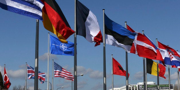 Flags fly at the Alliance headquarters in Brussels during a NATO ambassadors meeting on the situation in Ukraine and the Crim