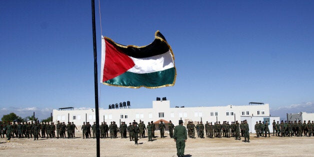 Palestinian officers from the national security forces loyal to Palestinian President Mahmoud Abbas participate in a military