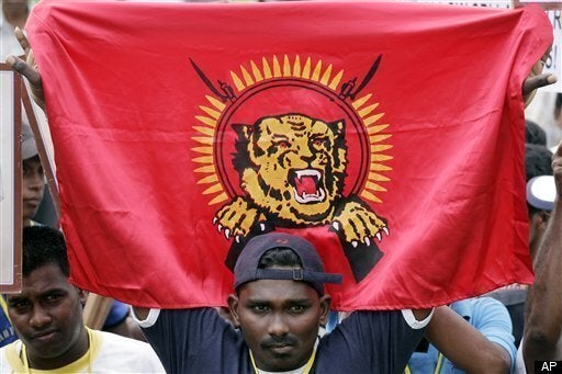 Refugees from Tamil Tiger areas cross over from Tamil Tiger rebel