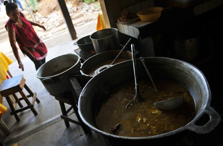 Maria Luisa sells garrobo (black spiny-tailed iguana) soup, Pinol of iguana and other dishes, at the Roberto Huembes market in Managua, on March 16, 2013. Garrobo soup, beef soup with iguanas and turtles are some of the exotic dishes with alleged aphrodisiac power, that delight Nicaraguans, especially during Easter, despite the ban that rules on these endangered species. AFP PHOTO/Hector RETAMAL (Photo credit should read HECTOR RETAMAL/AFP/Getty Images)